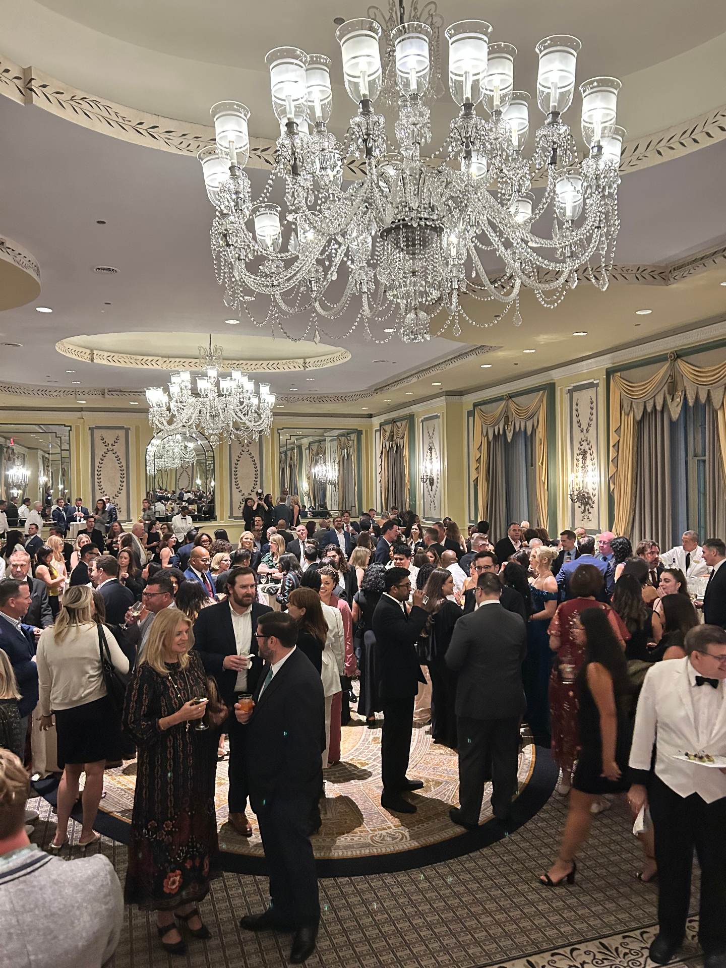 Ballroom premiere reception under chandeliers